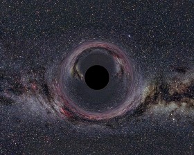 Symulacja wyglądu czarnej dziury o masie dziesięciu Słońc widzianej z odległości 600 km. W tle Droga Mleczna. Zbliżenie na taką odległość do czarnej dziury nie jest możliwe. W tej dziedzinie możemy zdać się tylko na symulacje i wizualizacje.