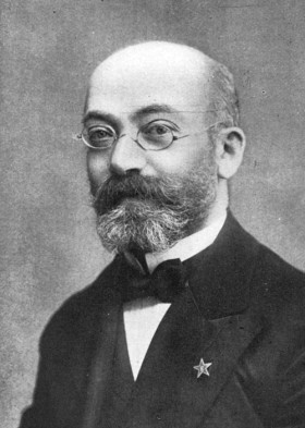 Ludwik Zamenhof z symbolem języka esperanto w klapie