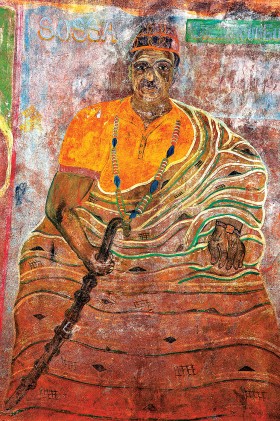 Malowidła na ścianie domu w Possotome, przedstawiające Sossa Guedehoungue - papieża voodoo.