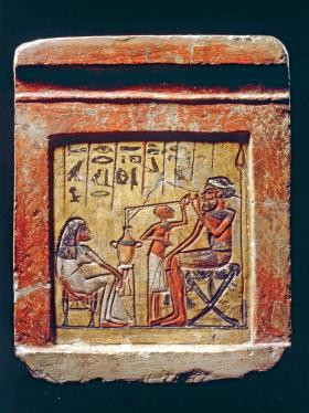 Egipska stela, ok 1350 r. p.n.e., przedstawiająca Syryjczyka pijącego piwo przez rurkę.