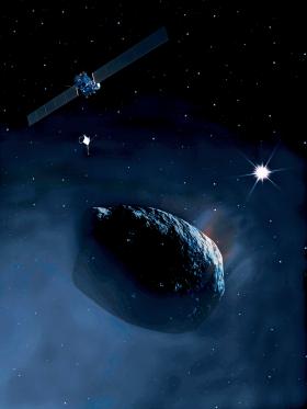 Sonda Rosetta na orbicie wokół jądra komety Czuriumow-Gerasimienko. Widać też lądownik Philae.