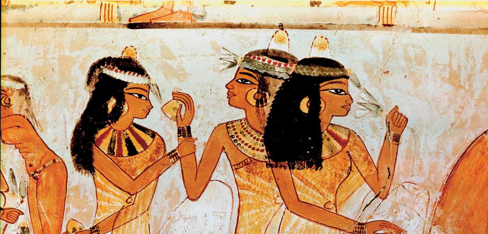 Fragment malowidła z egipskiego grobowca Nachta przedstawiający kobiety ze stożkami zapachowymi na głowie.