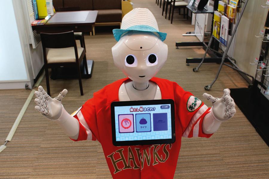 Chiba, Japonia. Robot pomagający w obsłudze klienta firmy Softbank. Z takim spojrzeniem potrafi ­zachęcić każdego do rozmowy.