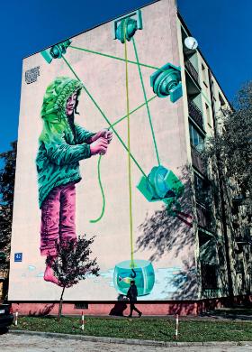 Mural „Chłopczyk z wędką” przy ulicy Antoniukowskiej w Białymstoku.