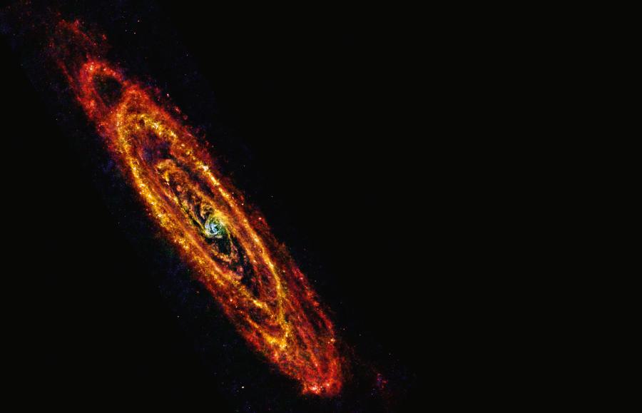 Nasza najbliższa sąsiadka, czyli Galaktyka Andromedy (M31), widziana w podczerwieni przez Kosmiczne Obserwatorium Herschela (ESA),.