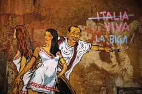 Uliczny mural Mauro Pallotta przedstawiający Silvio Berlusconiego na imprezie z kobietami przebranymi za starożytne Rzymianki.