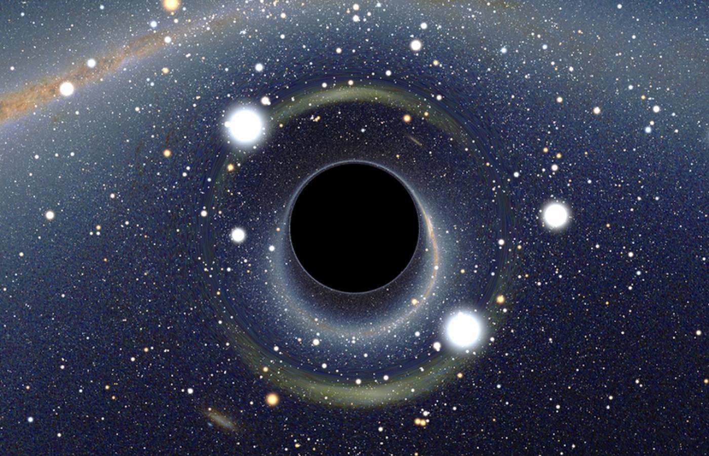 Symulowany widok czarnej dziury umieszczonej przed Wielkim Obłokiem Magellana. Na skutek efektu soczewkowania grawitacyjnego powstały dwa powiększone, lecz mocno zniekształcone obrazy Obłoku.