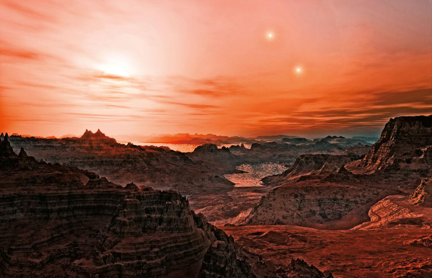 Artystyczna wizja zachodu trzech słońc planety Gliese 667 Cc. Jest to jedna z niewielu planet naszego kosmicznego zaułka, na których może istnieć woda w stanie ciekłym.