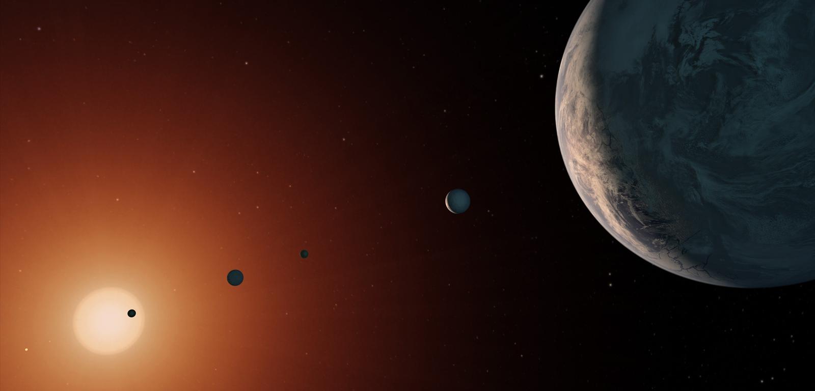 Tak mógłby wyglądać system TRAPPIST-1 z punktu obserwacyjnego w pobliżu planety TRAPPIST-1f (po prawej).