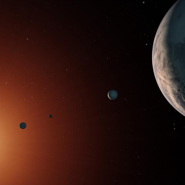 Tak mógłby wyglądać system TRAPPIST-1 z punktu obserwacyjnego w pobliżu planety TRAPPIST-1f (po prawej).