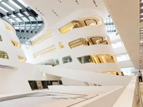 LibraryWide, spiral ramps and stairways lead from the entry area up through the OMV Central Library, which extends funnel-like through 6 stories of the building. The top two floors are dedicated entirely to the library, where the wide, glassfronted student work area offers a athtaking view of Prater Park.