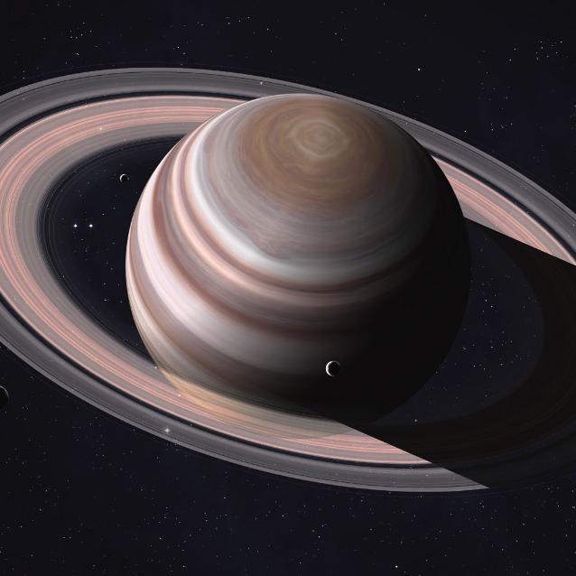 Kolorowy obraz Saturna uzyskany przez sondę Cassini. Widać pierścienie planety, przerwy między nimi i liczne małe księżyce wewnętrzne.