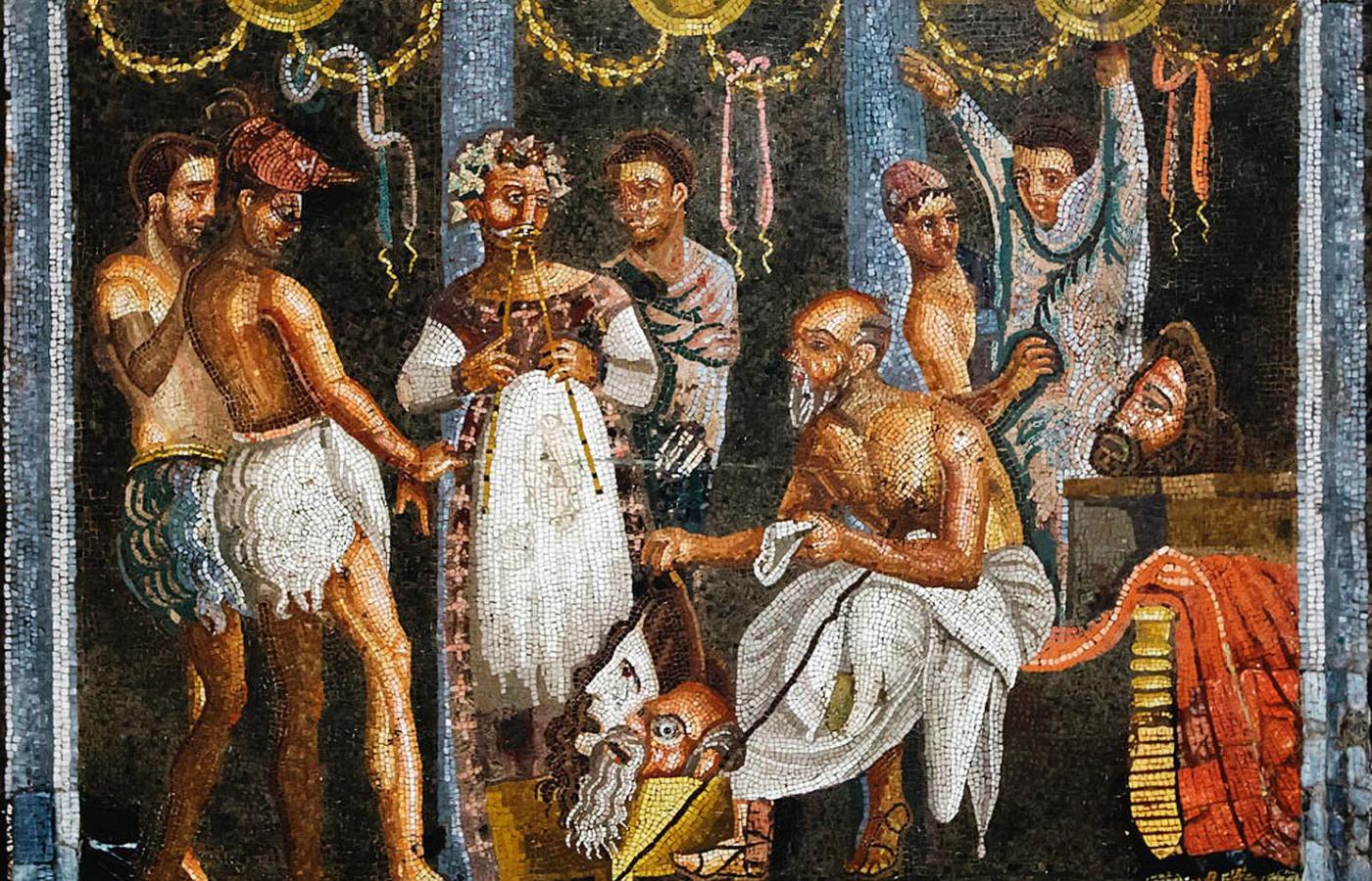Flecista i aktorzy w strojach z koziej skóry przygotowujący się do występu w teatrze; mozaika z I w. n.e.